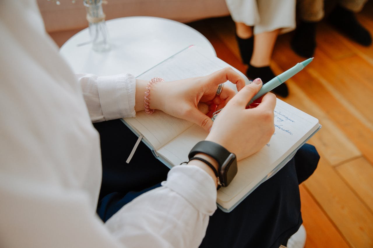 Mastering the First Impression: Your intriguing post title goes here Close-up of a person taking notes during a therapy session, highlighting mental health focus.